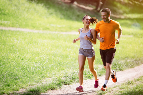 Couple running together in park