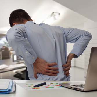 Man at desk with back pain