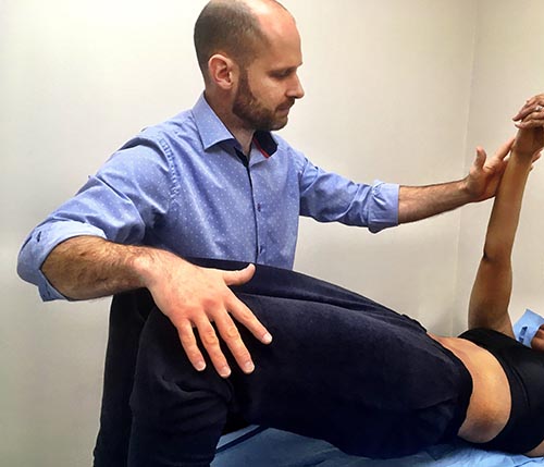 Osteopath Gavin Smith performing treatment at London osteopathy clinic